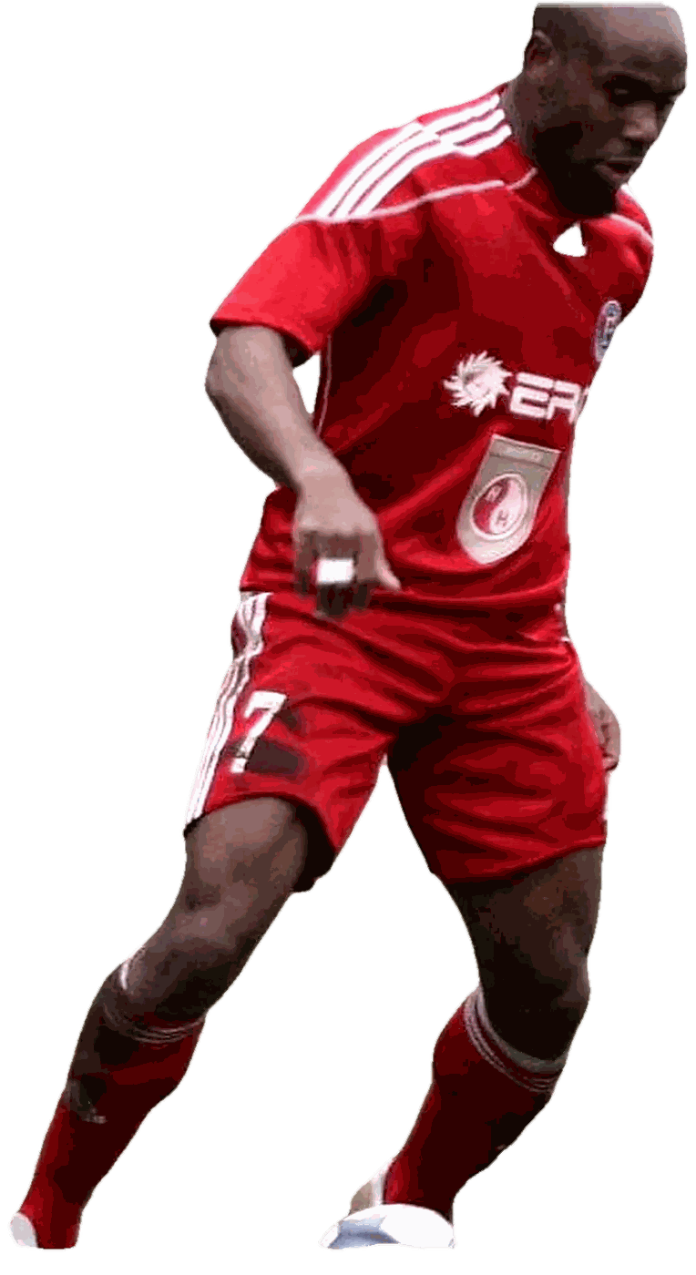 Stephen Ademolu in the red of FK Ekranas, in full stride and driving forward