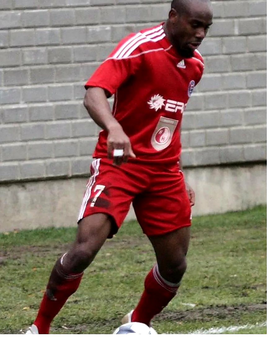 Stephen Ademolu on the ball in the red kit of FK Ekranas